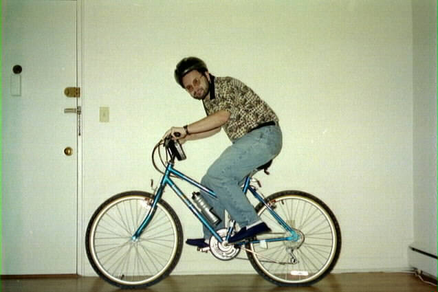 Eugene rides a bike in his Delaware appartment, Winter 1998